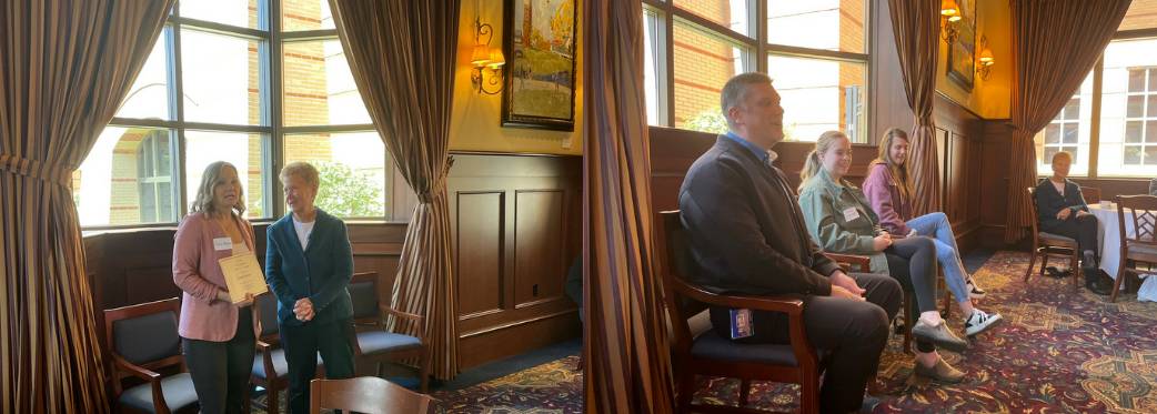 photo of people sitting off to the side of a small banquet room